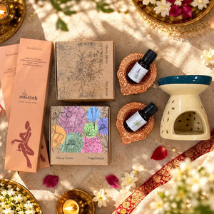 Amayah Diwali Sacred Bag contents: incense, essential oils and diffuser arranged as a festive gift set.